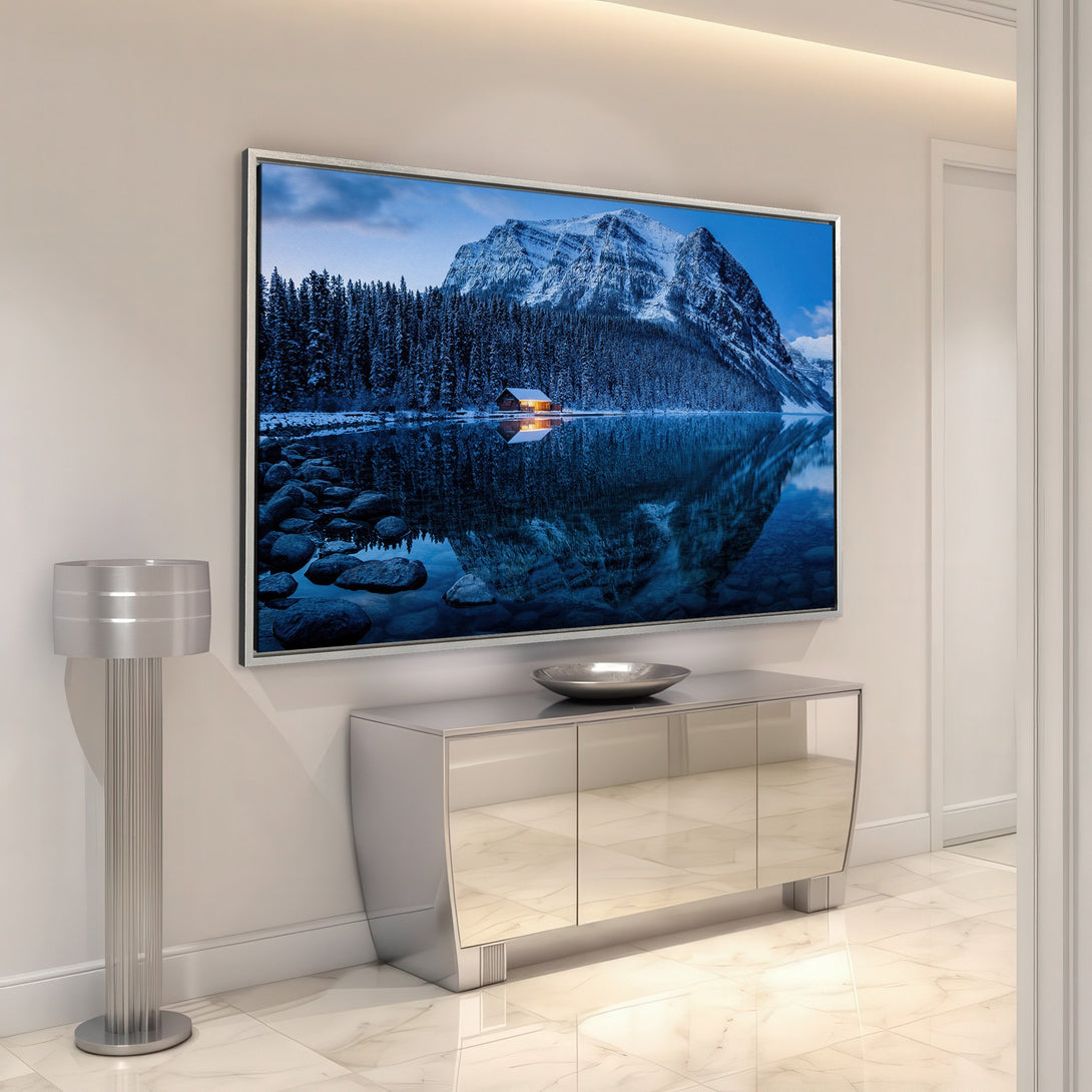 Framed Wall Art of a snowy mountain landscape in cool blue tones. Add serene beauty to your home with this Canvas Print.