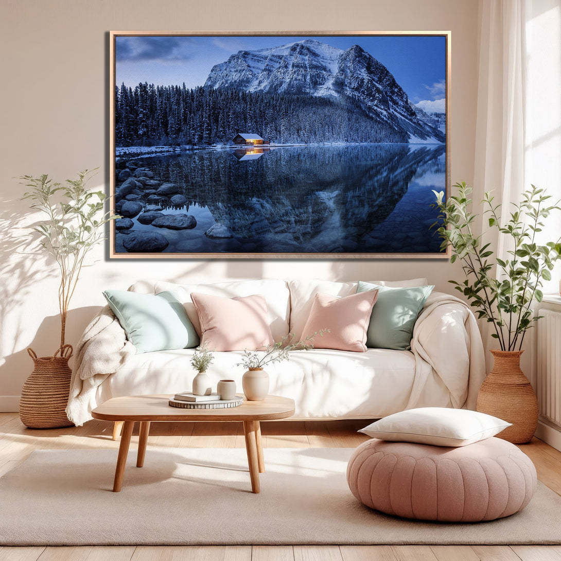 Framed Wall Art of a snowy mountain lake scene in blue tones, adding a touch of nature to a cozy living room.