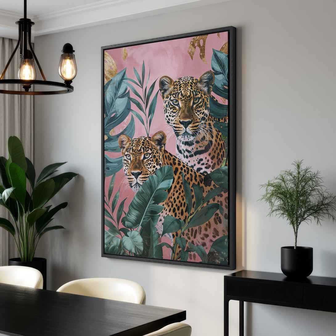 Framed Wall Art featuring leopards in a tropical jungle scene. Pink, green, and gold color palette. Perfect statement piece for your home decor.
