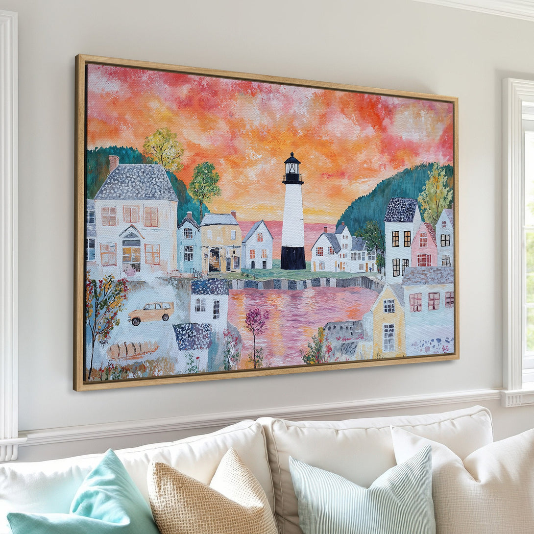 Framed Wall Art of a coastal town with a lighthouse, in a whimsical style with warm sunset colors. Perfect for adding a touch of charm to your home!