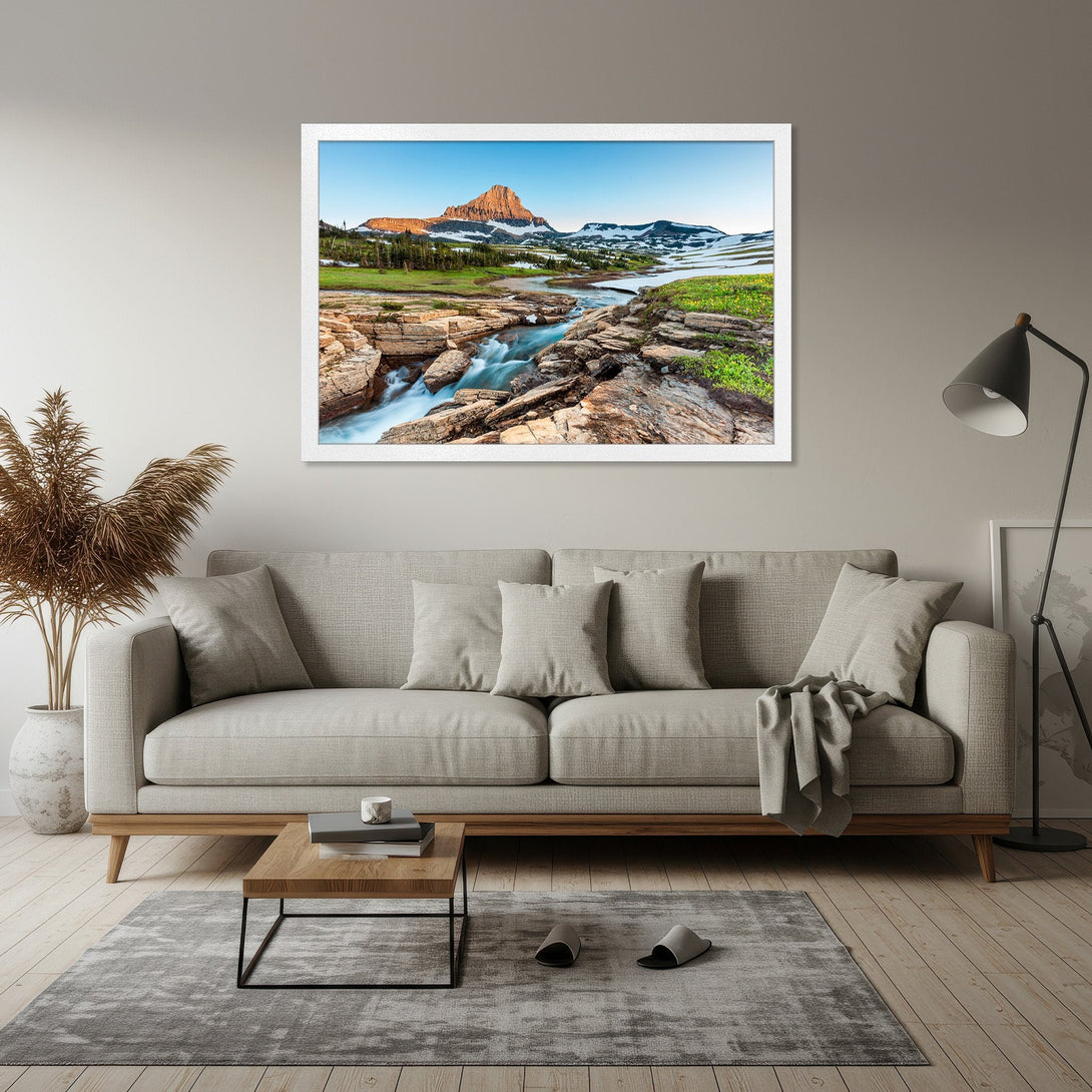 Framed Poster featuring a stunning mountain landscape with a flowing river, showcasing natural beauty in a vibrant blue and green palette.