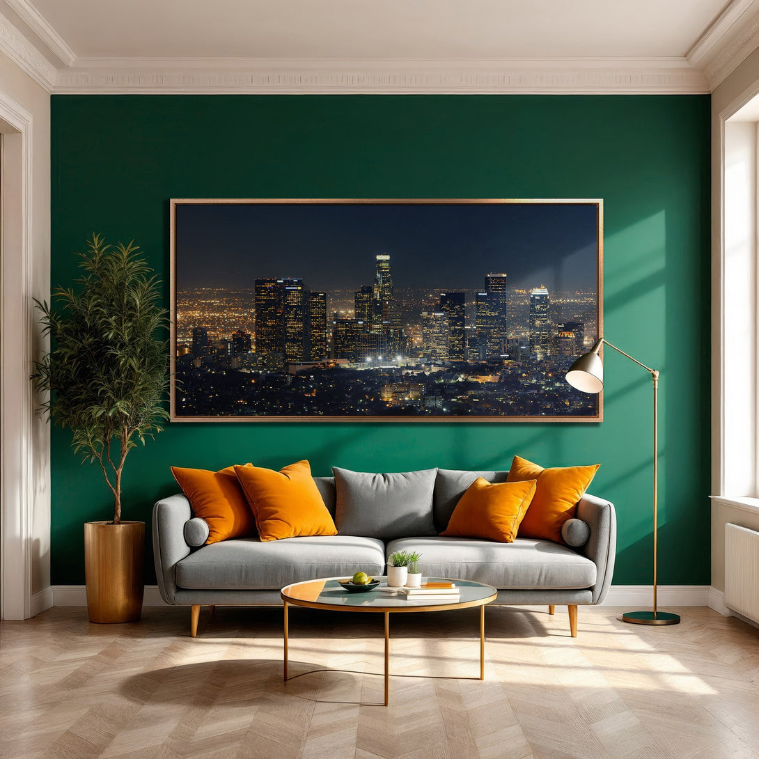Framed Wall Art featuring a night cityscape in a modern living room. Dark, moody color palette with emerald green wall and orange accents.