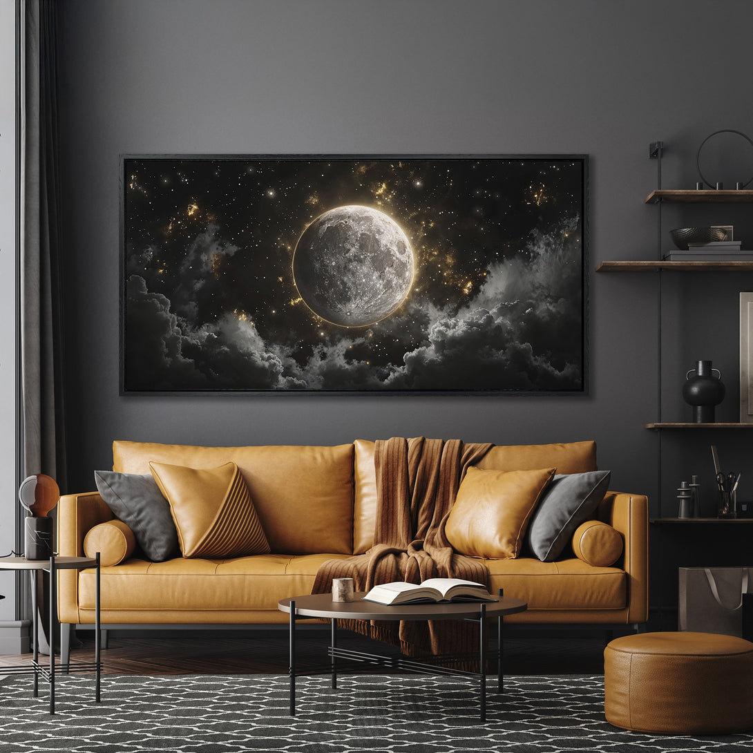 Framed Wall Art: Stunning moon and stars canvas print in a modern living room. Dark, moody color palette with gold accents. Elevate your space!