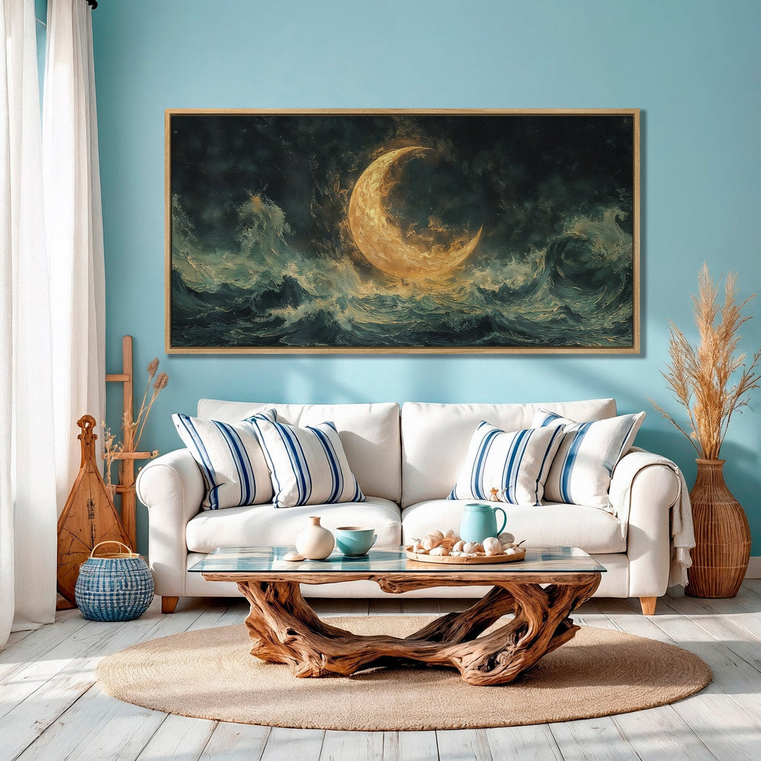 Framed Wall Art featuring a crescent moon over ocean waves. Dramatic, painterly style with a teal, gold, and dark blue color palette. Perfect for coastal decor.