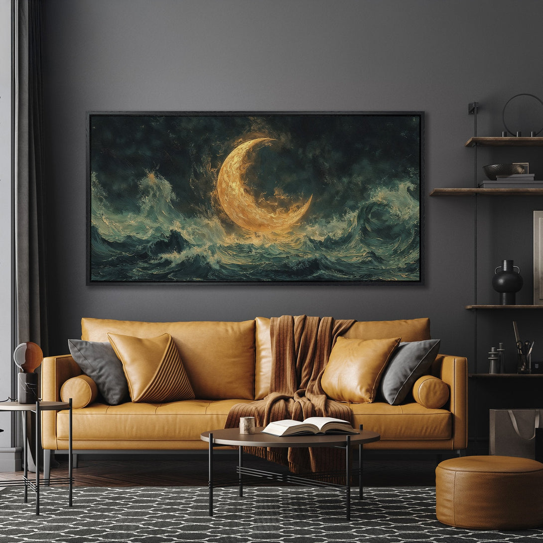 Framed Wall Art featuring a dramatic moonlit ocean scene in teal and gold. Perfect for adding a touch of moody elegance to your living room.