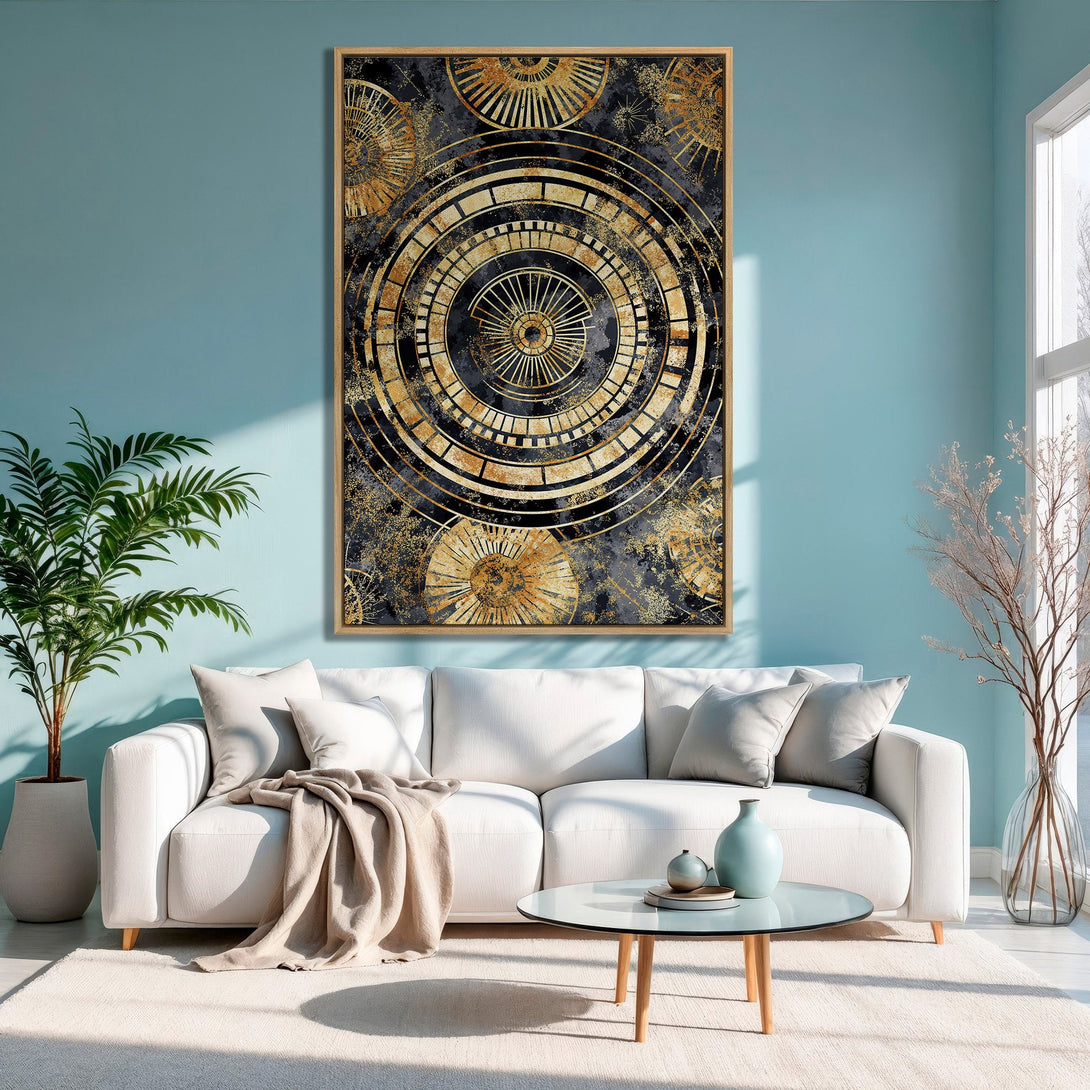 Framed Wall Art: Abstract gold & black geometric design canvas print. Modern art in a living room with a blue & neutral color palette. Elevate your space!