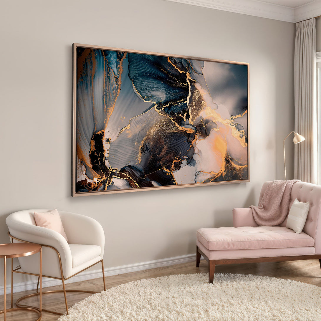 Framed Wall Art featuring an abstract fluid art design with gold accents, in a modern interior. Color palette: blues, golds, and neutral tones.