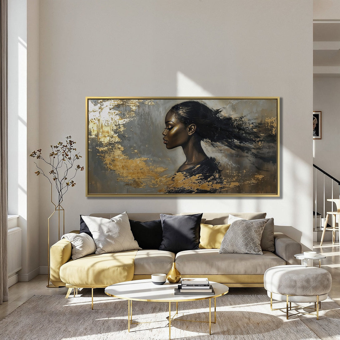 Canvas Print of a woman's portrait in gold and black abstract style, displayed in a modern interior with red chairs.
