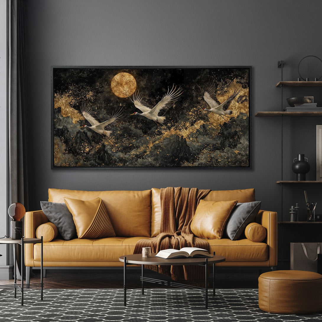 Framed Wall Art featuring cranes in flight. Dramatic black, gold, and white color palette. Modern art for living room decor.