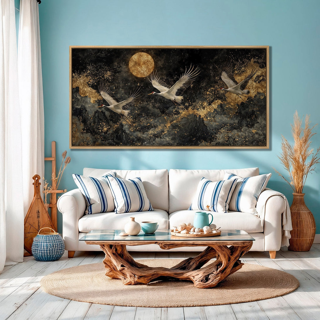 Framed Wall Art: Cranes in flight over a dark, gold-speckled landscape. Modern art with a black, gold, and white color palette. Perfect home decor.
