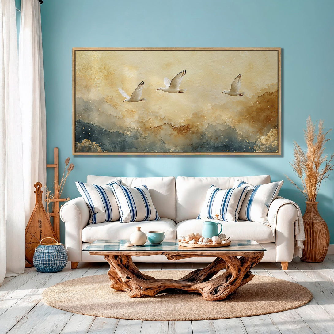 Framed Wall Art featuring watercolor seagulls in flight. Coastal decor with a warm, neutral color palette. Perfect for a serene living room.