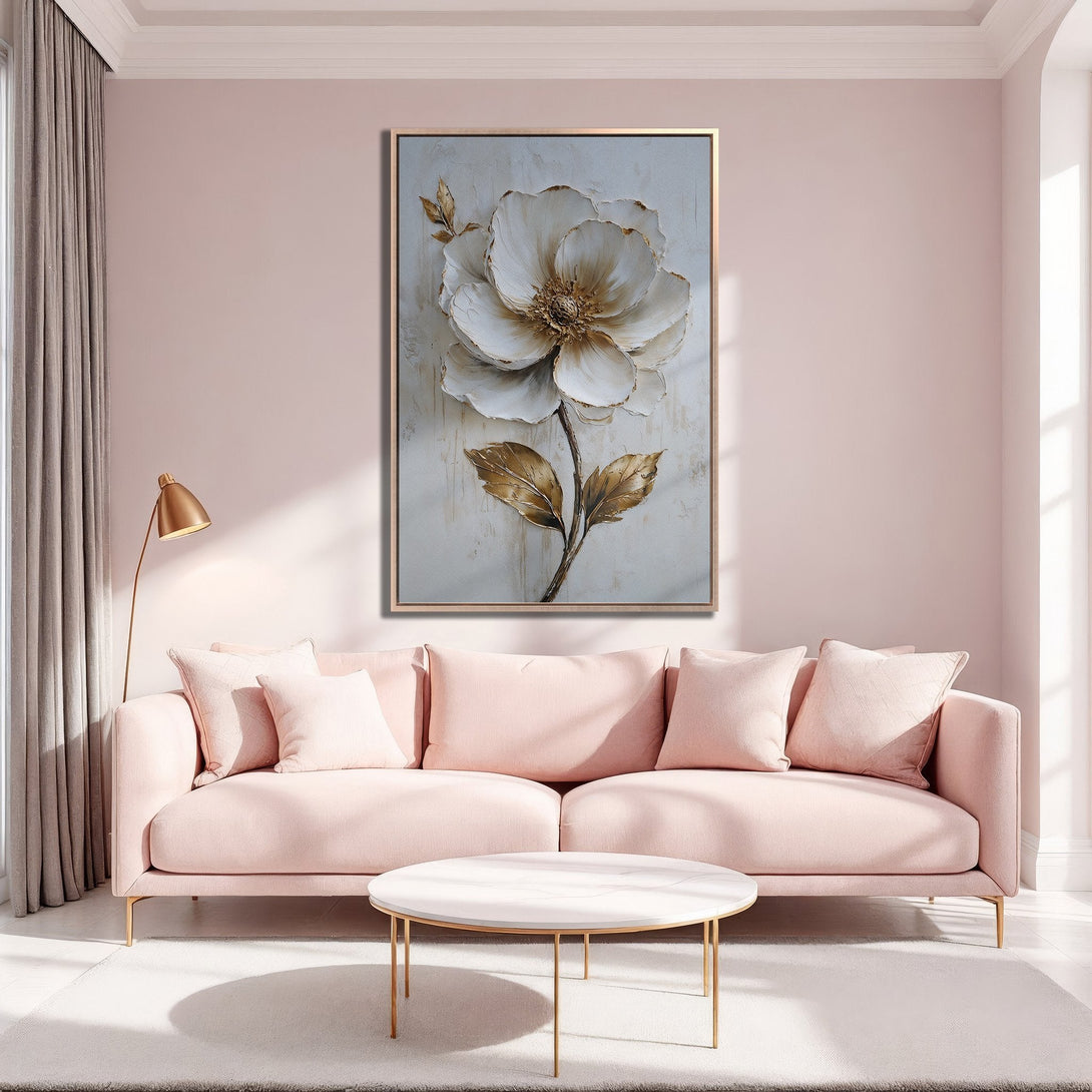 Framed Wall Art featuring a large, textured white flower with gold accents. Soft pink and gold color palette, perfect for adding elegance to any space.
