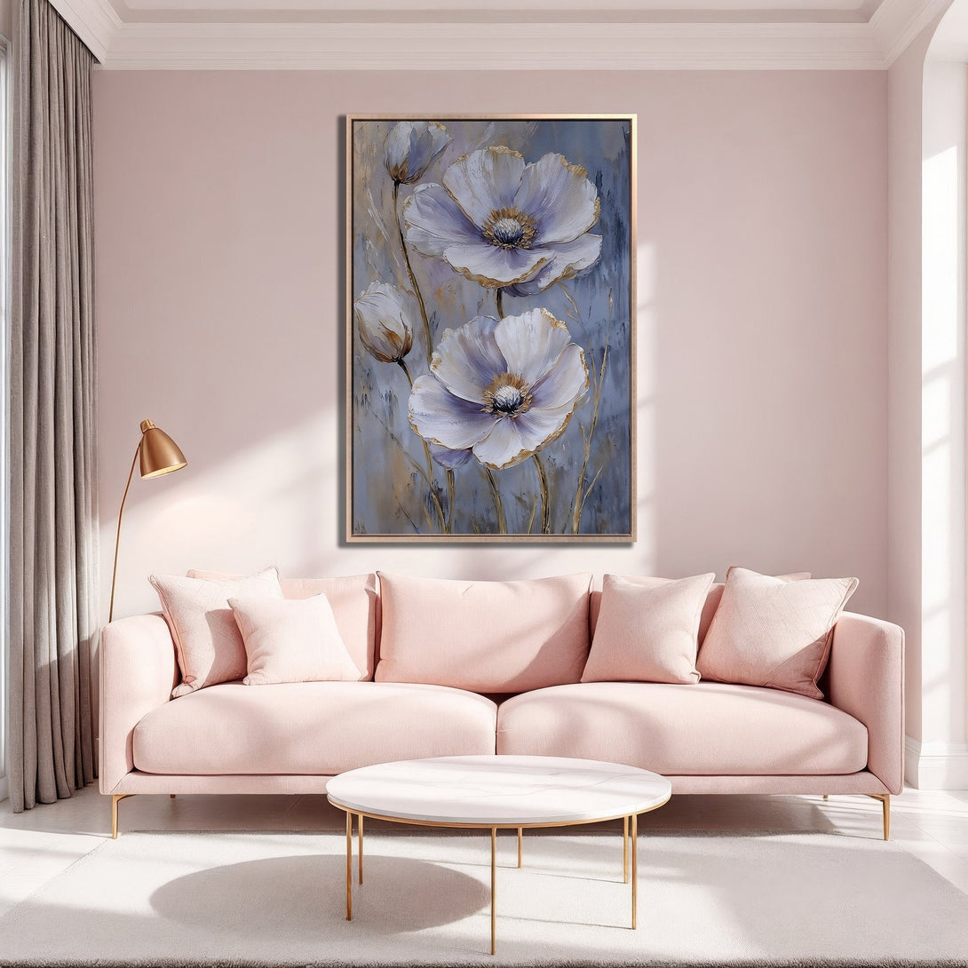 Framed Wall Art featuring elegant white floral painting with gold accents, displayed in a modern, blush pink living room. Enhance your space with this beautiful canvas print!