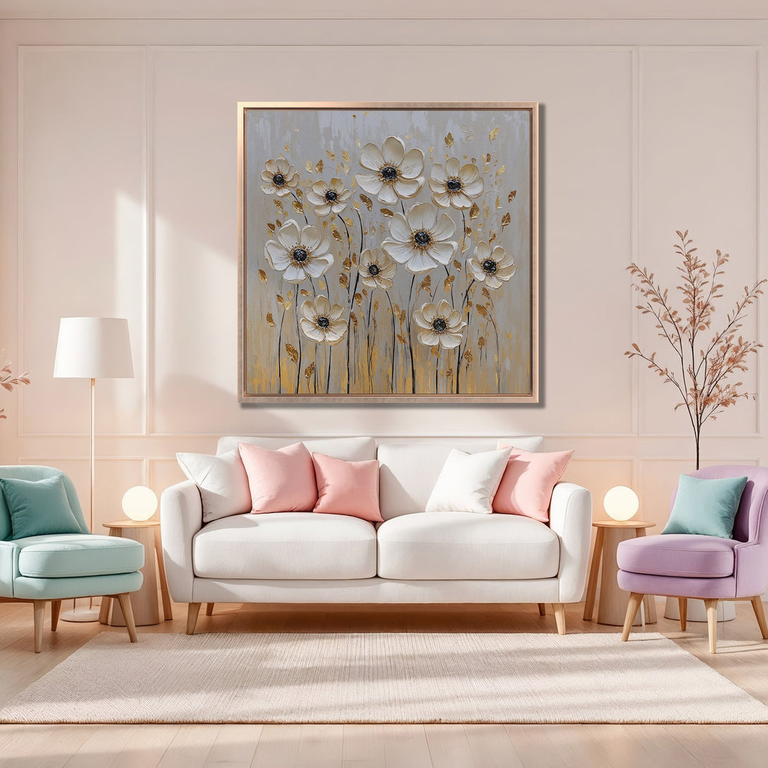 Framed Wall Art featuring elegant white flower painting with gold accents, displayed in a stylish living room with a soft, neutral color palette.