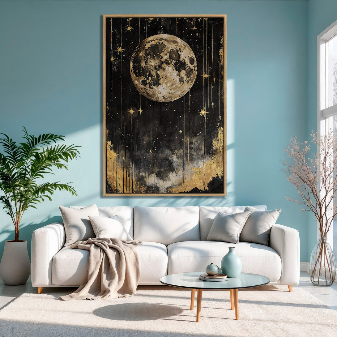 Framed Wall Art featuring a celestial moon and stars in black and gold tones, perfect for adding a touch of art to your living room.