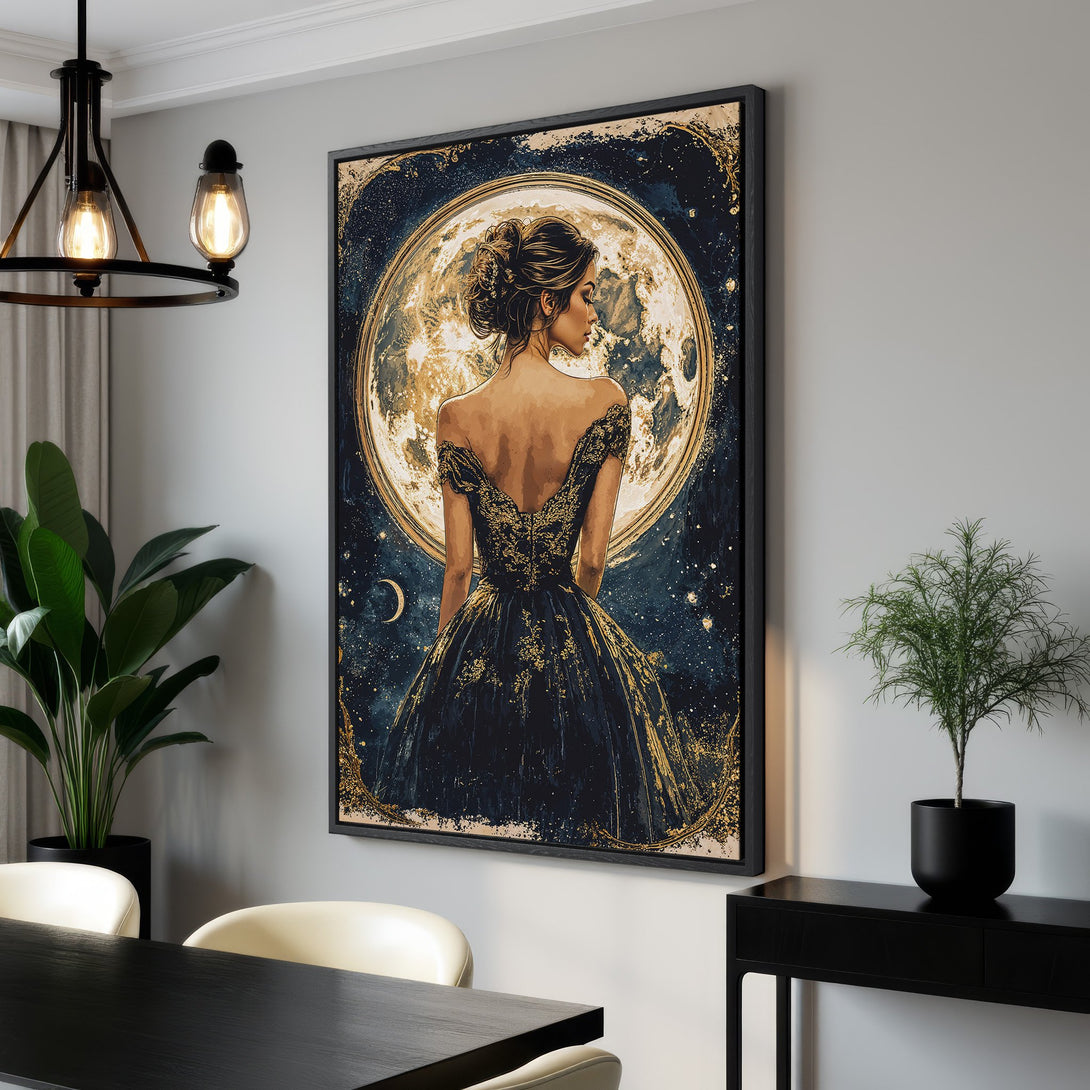 Framed Wall Art featuring a woman in a gown before a moon, with a celestial design. Elegant style, rich gold and navy color palette. Perfect home decor.
