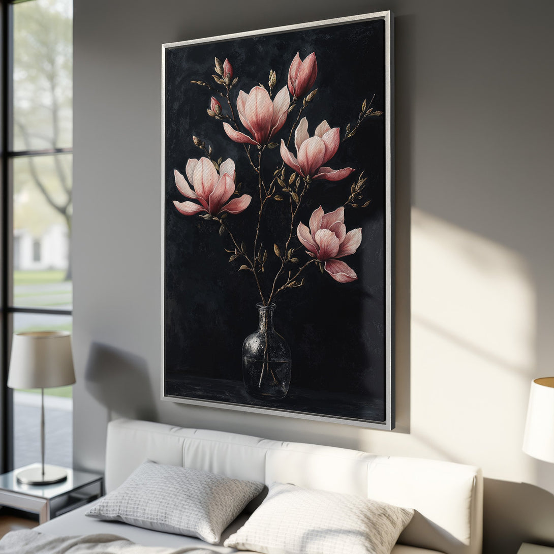 Framed Wall Art featuring elegant pink magnolia flowers against a dark background. Adds a touch of sophistication with its moody color palette.
