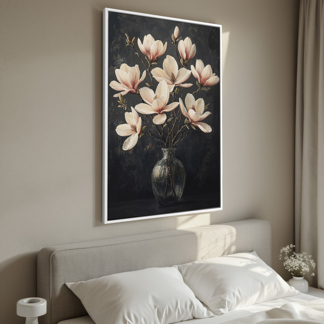 Framed Wall Art featuring elegant magnolia blossoms in a vase. Dark, moody background with soft pink and cream flowers, perfect for adding a touch of art to your bedroom.