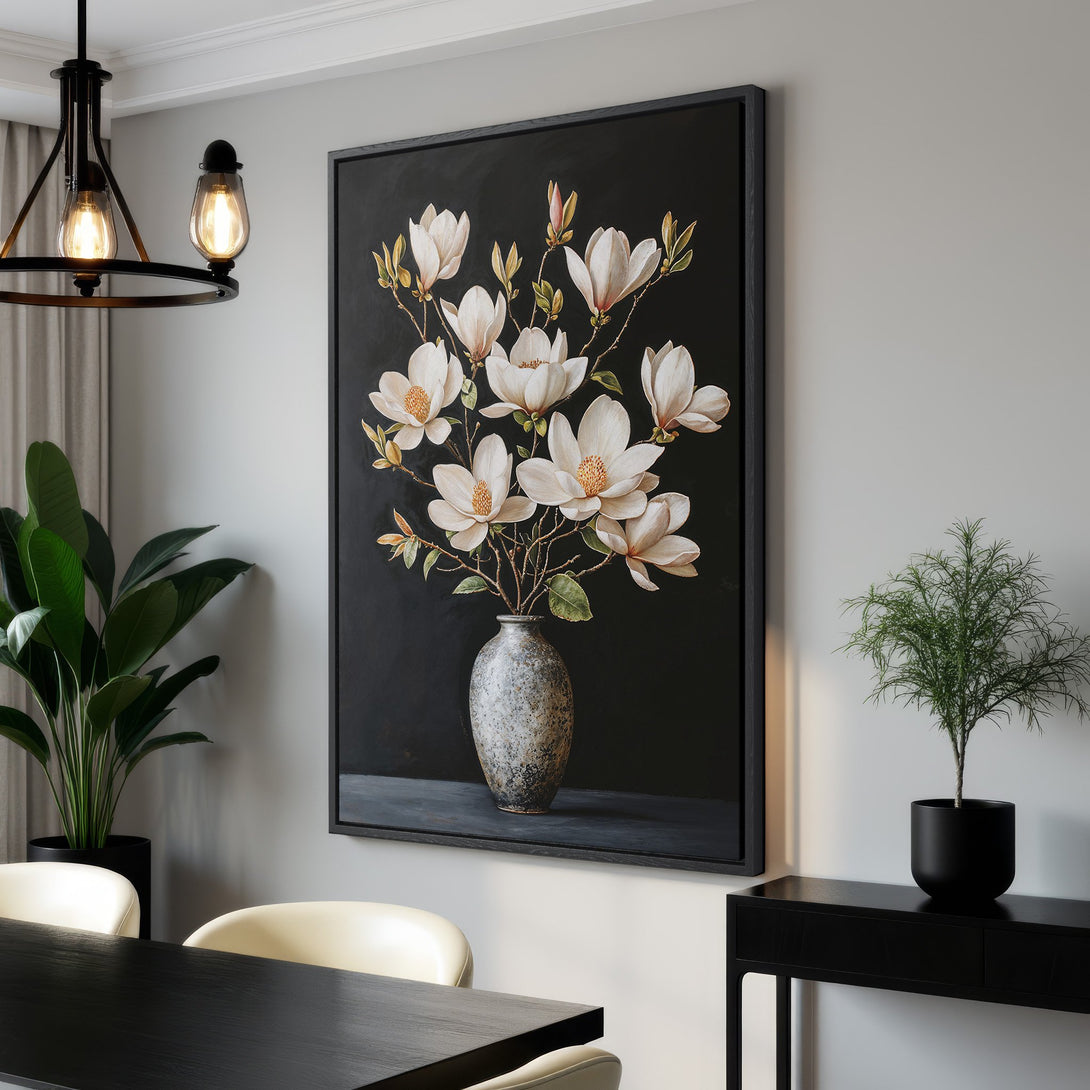 Framed Wall Art: Elegant floral canvas print featuring white magnolias against a dark background. Perfect for adding a touch of sophistication to any space. Neutral color palette.