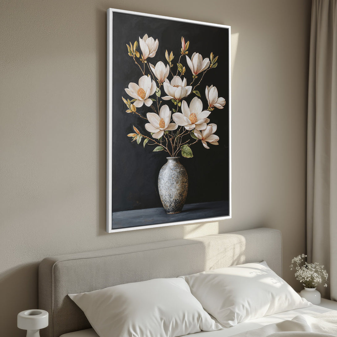 Framed Wall Art: Elegant magnolia flower painting in neutral tones. Perfect bedroom decor. Featuring a white framed canvas print with a black background.