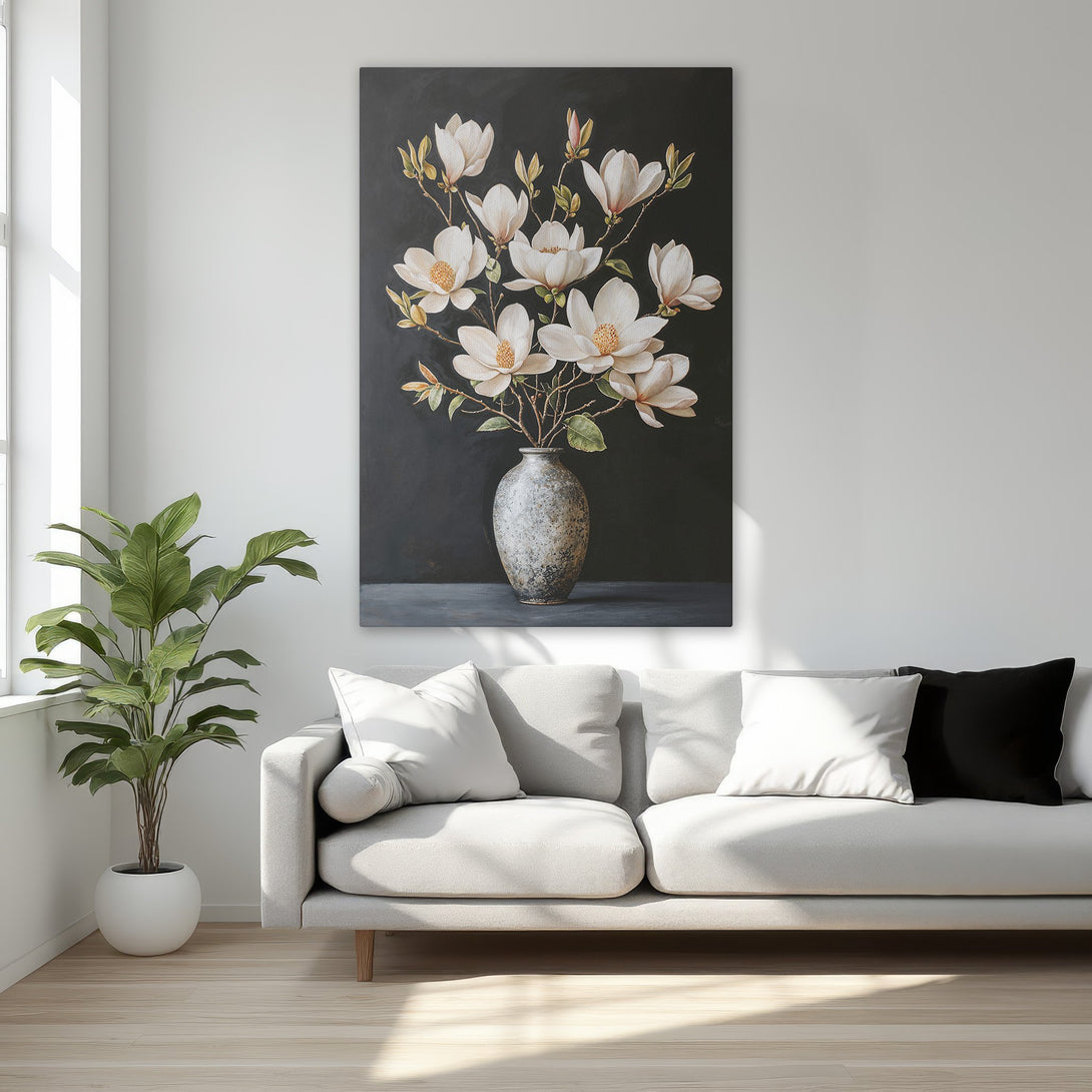 Framed Wall Art featuring white magnolia flowers in a vase, set against a dark background. Elegant floral art with a neutral and gold color palette.
