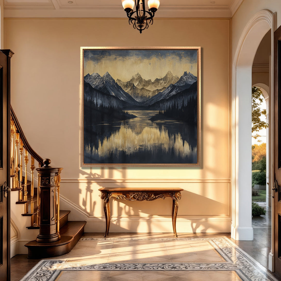 Framed Wall Art: Mountain landscape Canvas Print with a serene lake, displayed in a luxurious interior. Features a cool, muted color palette of blues, grays, and golds.