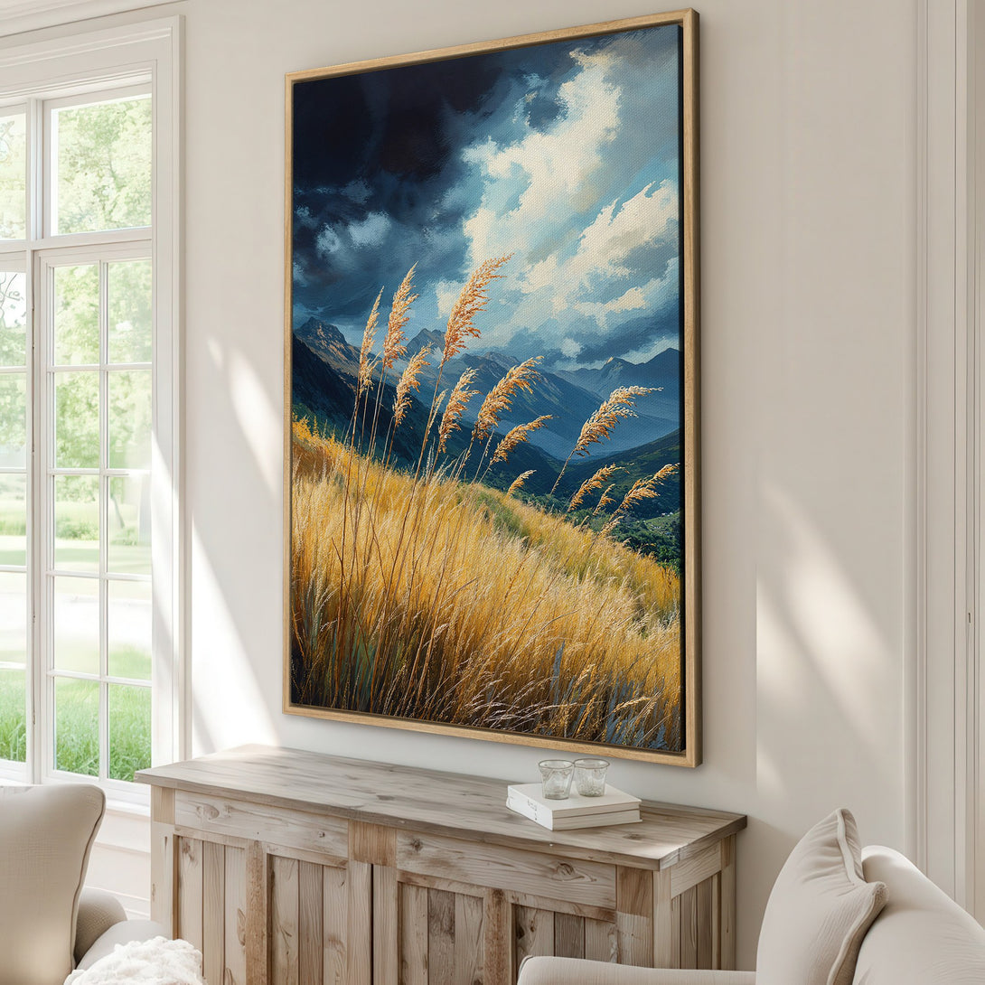 Framed Wall Art: Dramatic landscape Canvas Print with golden grasses, mountains, and moody sky. Earthy tones of gold, blue, and green, perfect for home decor.