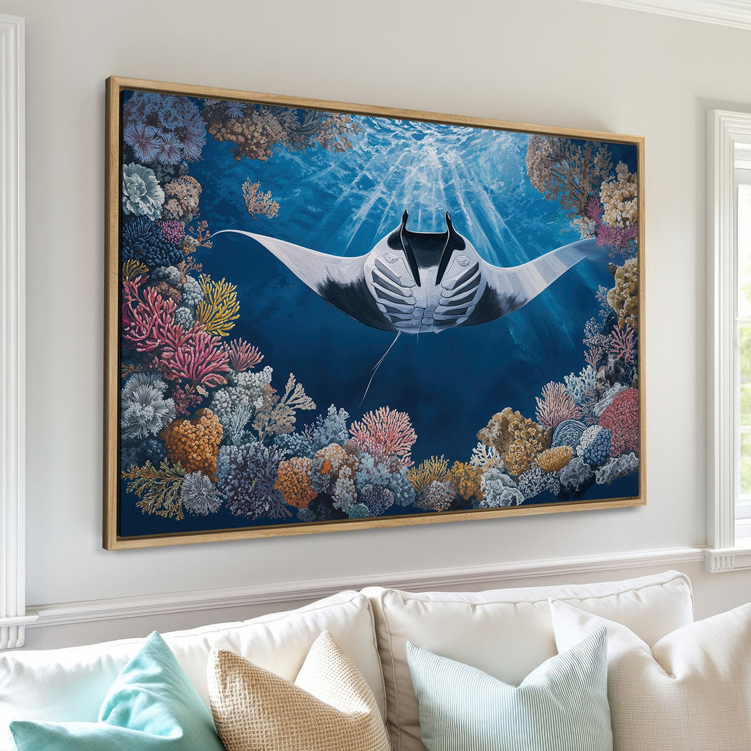 Framed Wall Art featuring a majestic manta ray swimming in a vibrant coral reef. Stunning blue, pink, and yellow color palette. Elevate your space with ocean art!