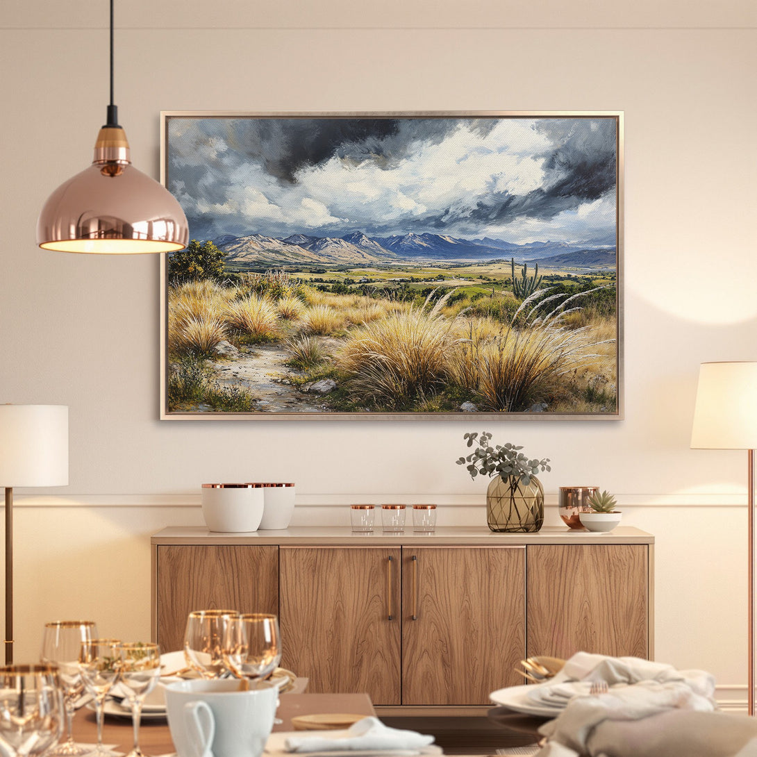 Framed Wall Art: Landscape painting canvas print with mountains, grassy fields & stormy sky. Earthy tones create a serene, natural aesthetic.