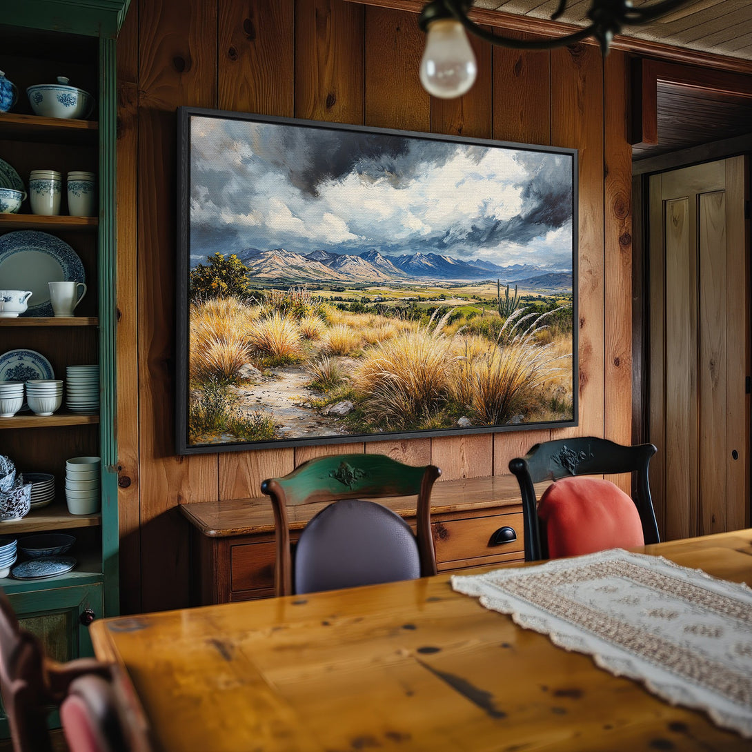 Framed Wall Art: Dramatic landscape canvas print in a cozy dining room. Features mountains, golden fields, and a moody sky, with a warm, earthy palette.