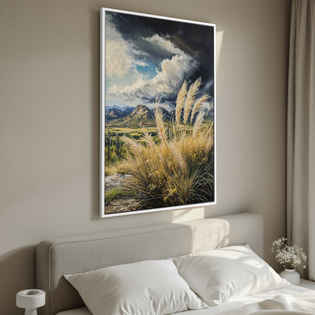 Framed Wall Art: Landscape painting of a desert scene with mountains, tall grasses, and dramatic sky. Earthy tones of beige, yellow, and blue create a calming aesthetic.