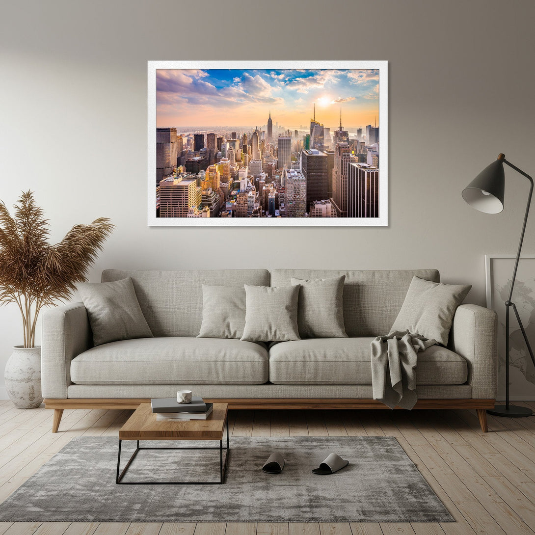 Framed Poster of NYC skyline at sunset. Modern style with warm orange and blue hues. Perfect wall art for your home.