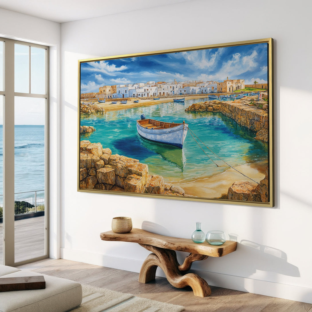 Canvas Print of a coastal scene with a boat, white buildings, and turquoise water. A beautiful piece of Framed Wall Art in a bright, airy interior.