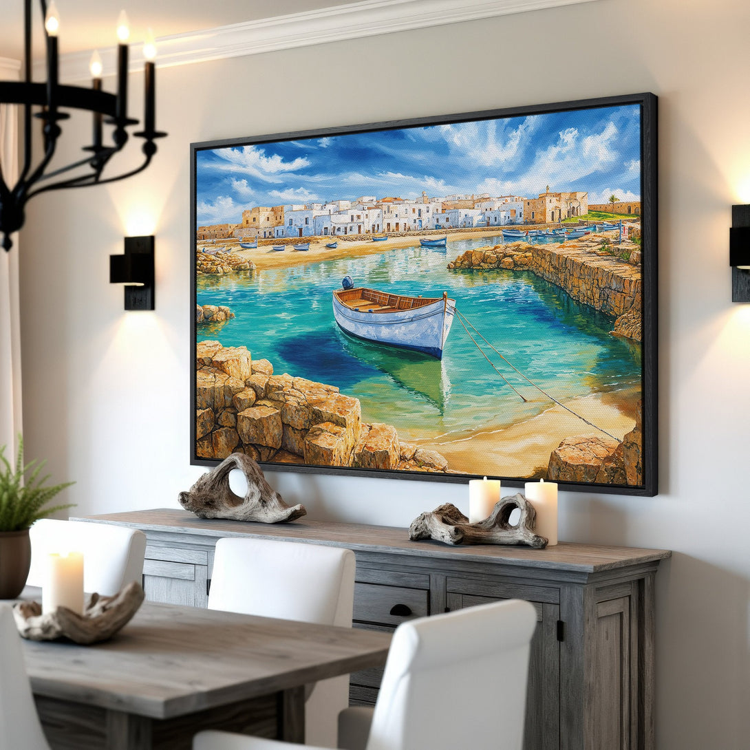 Framed Wall Art: Coastal scene Canvas Print with a boat in turquoise water, white buildings, and a blue sky. Adds a touch of Mediterranean charm.