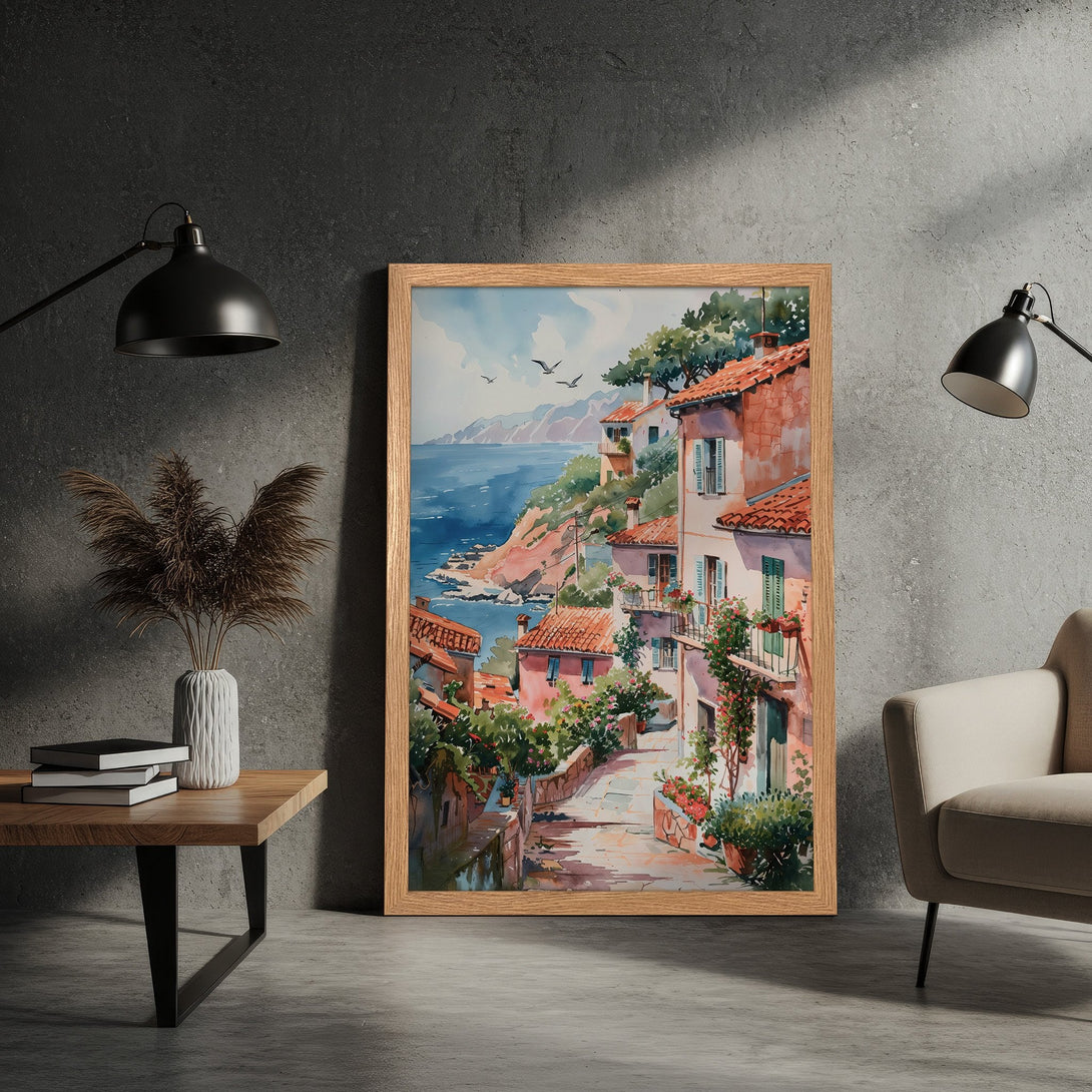 Framed Poster of a coastal village in watercolor style. Features a warm color palette of terracotta, blues, and greens. Perfect wall art for your home!