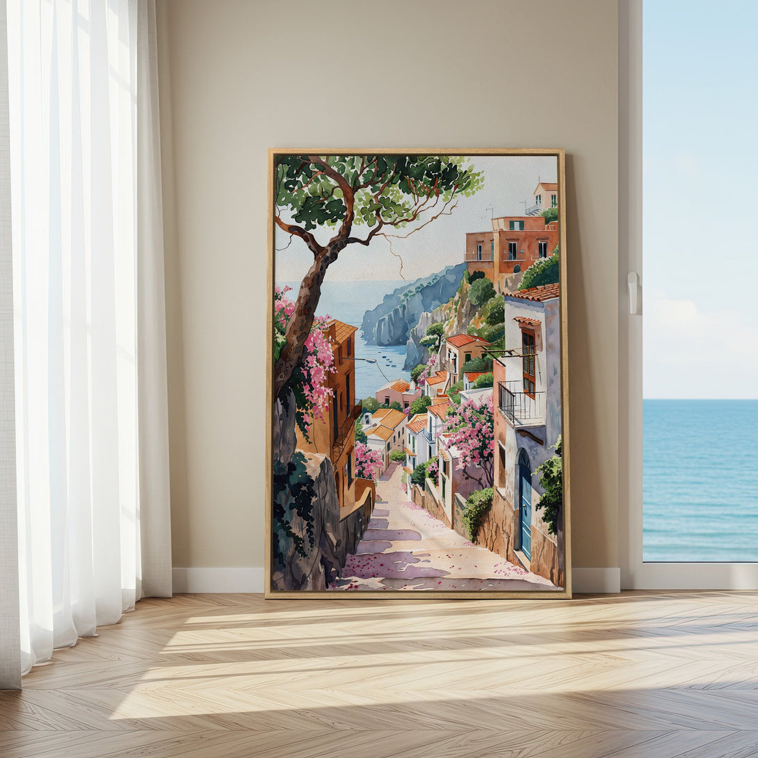 Framed Wall Art Canvas Print of a charming Italian coastal town. Watercolor style with warm earth tones, blues, and pops of pink. Perfect home decor.