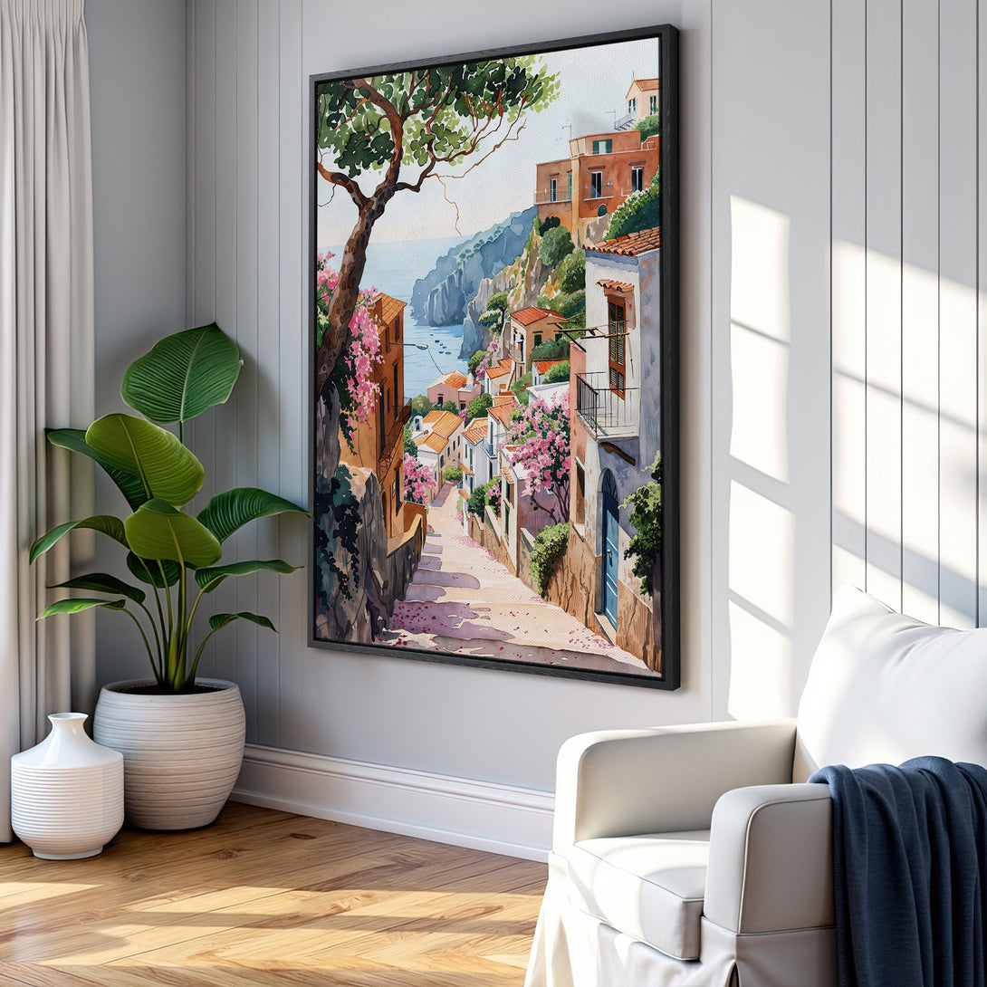 Framed Wall Art: Watercolor print of a charming Italian village, featuring a warm color palette of terracotta, pink, and blue. Perfect for adding a touch of Mediterranean charm.