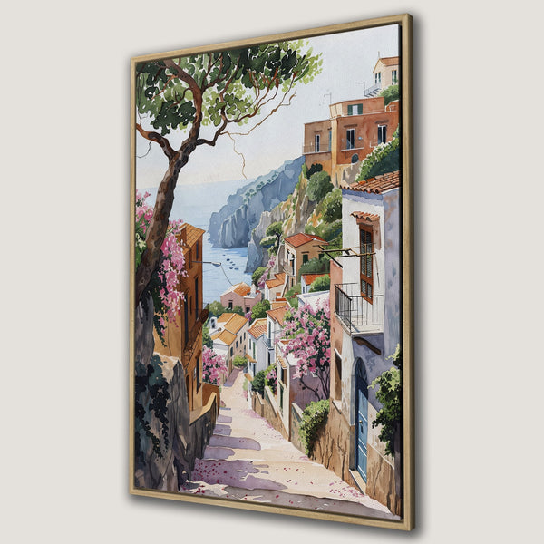 Framed Wall Art: Watercolor painting of a charming Italian village with colorful buildings, pink flowers, and a coastal view. Warm, inviting color palette.