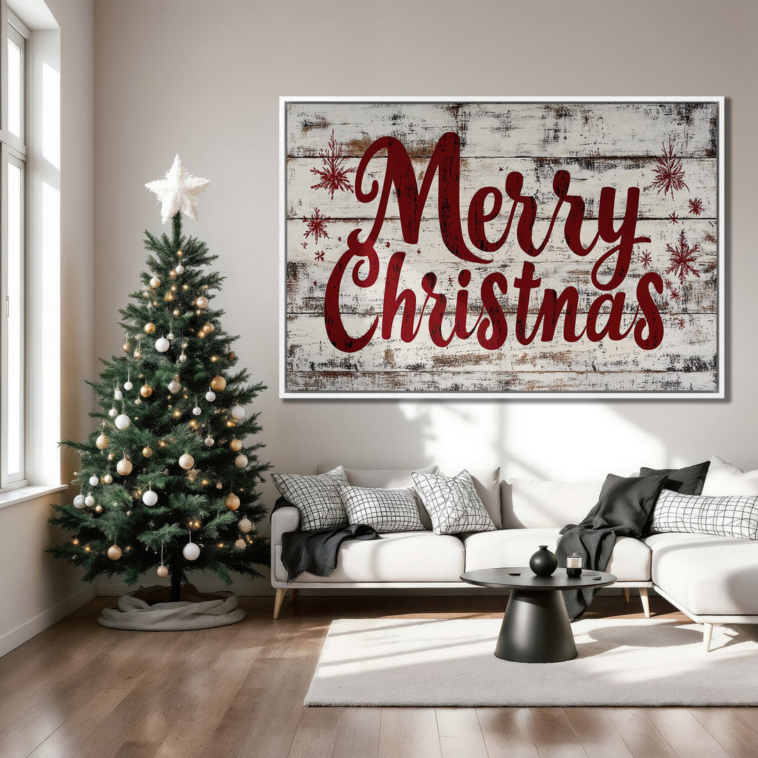 Framed Wall Art: "Merry Christmas" sign in rustic style with red lettering on a white wood background. Festive decor in a neutral-toned living room.