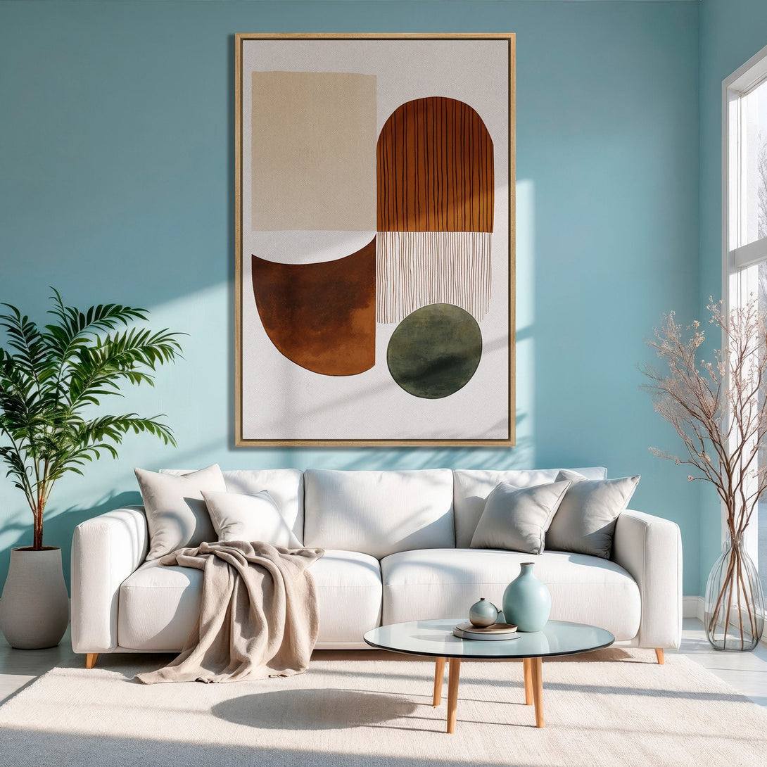 Framed Wall Art: Abstract geometric canvas print in warm earth tones, displayed in a modern living room with a calming blue color palette.