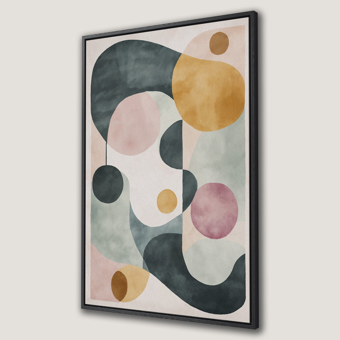 Framed Wall Art featuring an abstract geometric design with watercolor style shapes in muted pink, green, and yellow hues. Modern art for your home.
