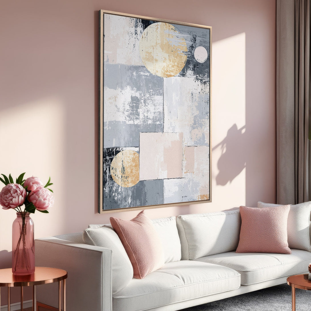 Framed Wall Art: Abstract geometric canvas print in a modern living room. Features a neutral color palette with blush pink, gray, and gold accents. Elevate your space!