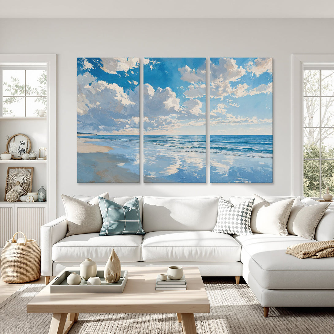 Canvas Print of a serene beach scene in blue and white, displayed in a modern living room. Coastal wall art perfect for any home.