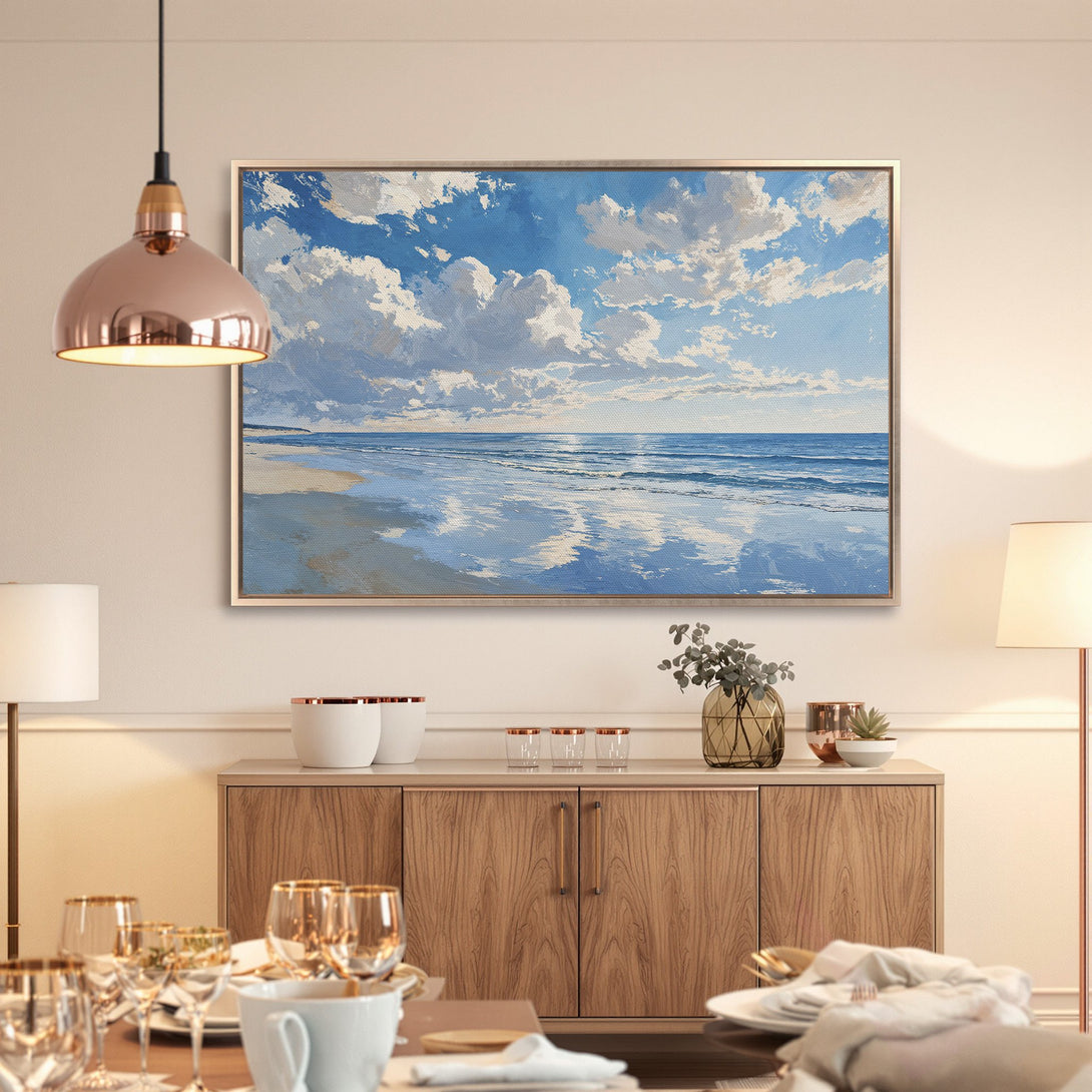 Framed Wall Art: Serene beach scene canvas print with blue, white, and beige tones. Perfect coastal decor for a calming living space.