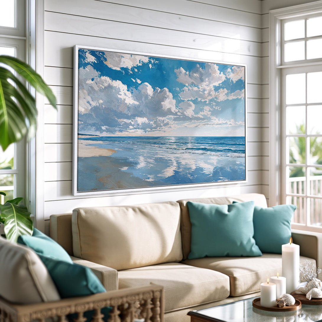 Framed Wall Art featuring a serene ocean scene with blue and white hues. Coastal style Canvas Print adds a calming touch to any interior.