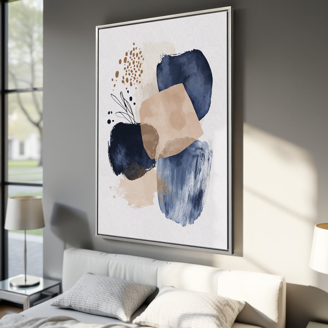 Framed Wall Art featuring abstract watercolor shapes in navy, beige, and gold. Modern canvas print adds a touch of elegance to any interior.