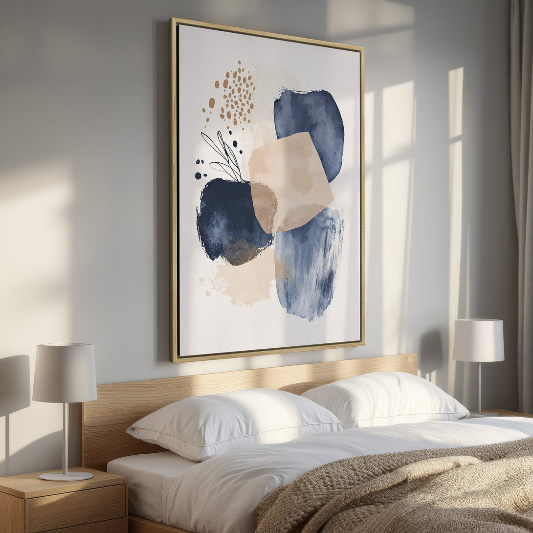 Framed Wall Art: Abstract art in a bedroom. Modern canvas print with blue, beige, and gold color palette. Perfect for adding a touch of elegance.
