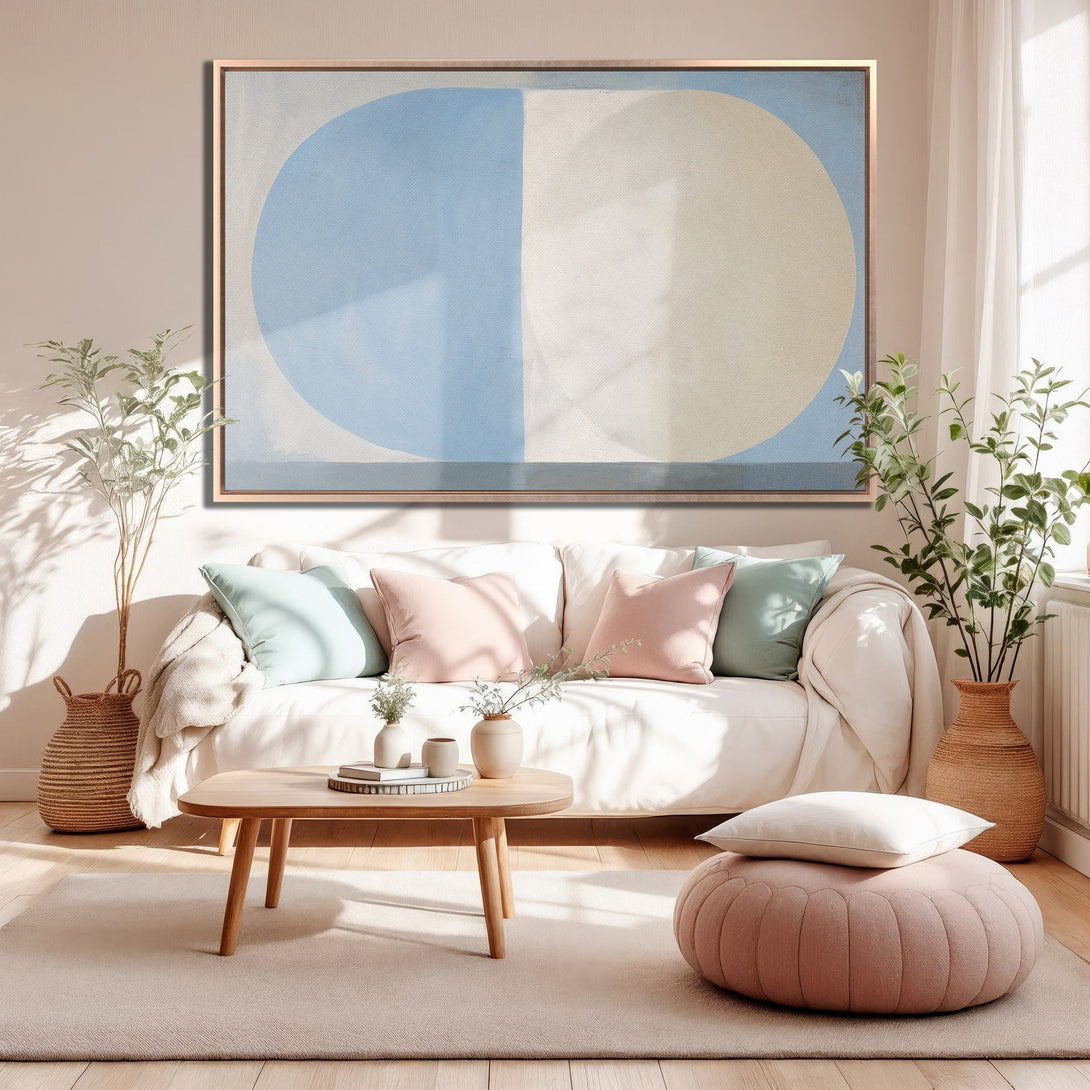 Framed Wall Art featuring a modern abstract design in blue and beige tones. Perfect for adding a touch of elegance to any living room.