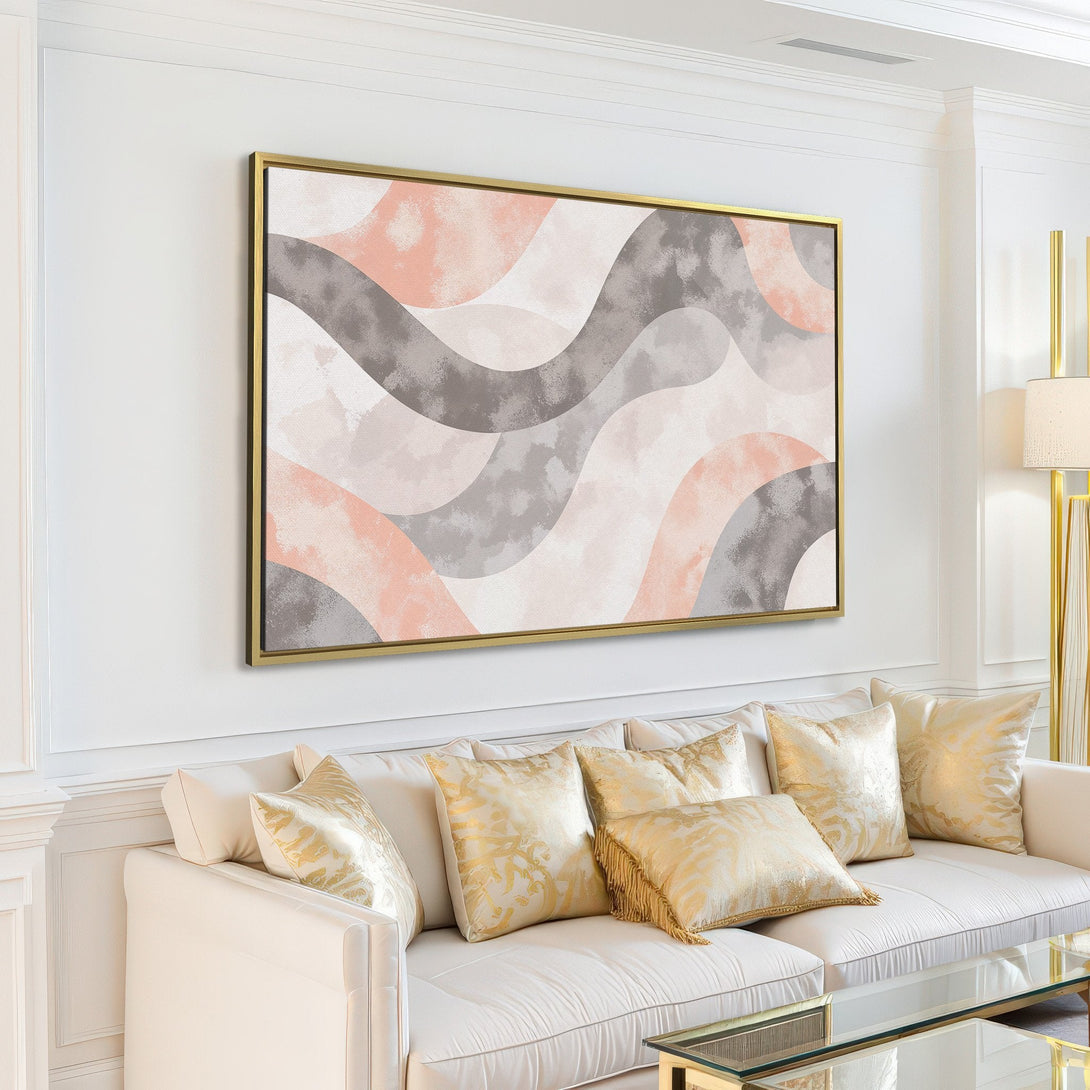 Abstract Canvas Print in a modern interior. Features flowing shapes in a soft, neutral color palette of gray, blush, and white. Perfect for any home!