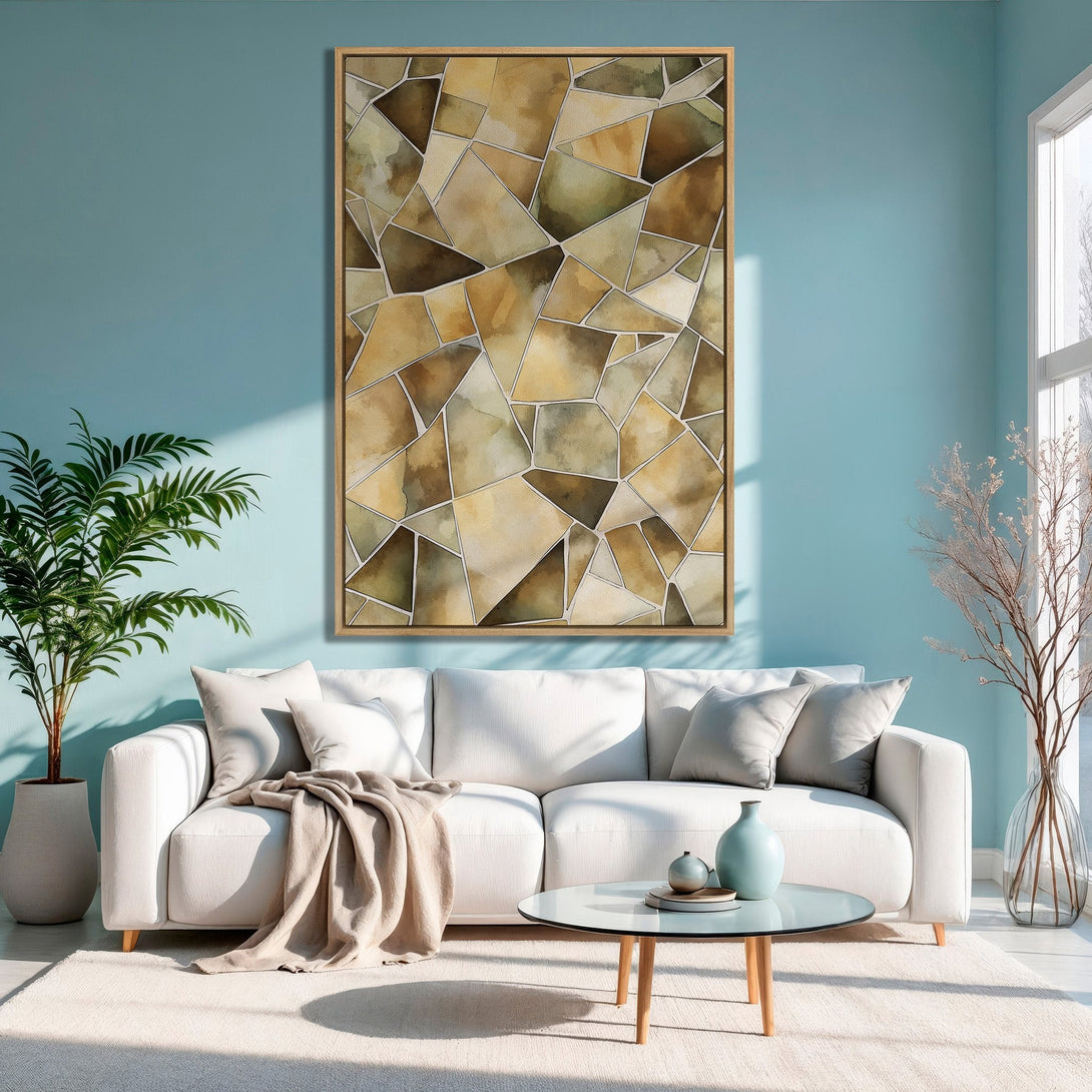 Framed Wall Art: Abstract geometric canvas print in warm earthy tones, displayed in a modern living room with a calming blue backdrop. Elevate your space!